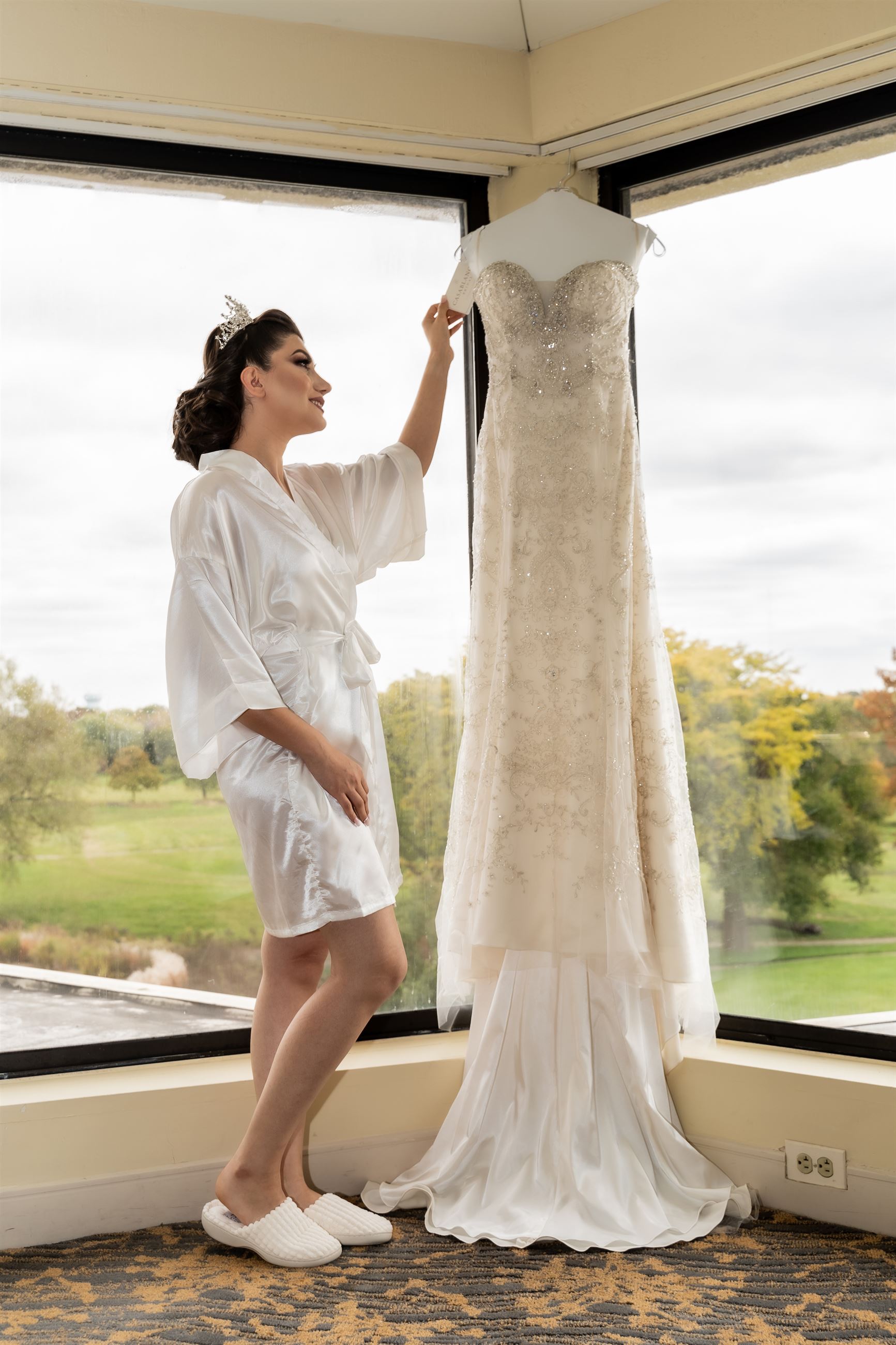 Bride Looking At Her Wedding Dress